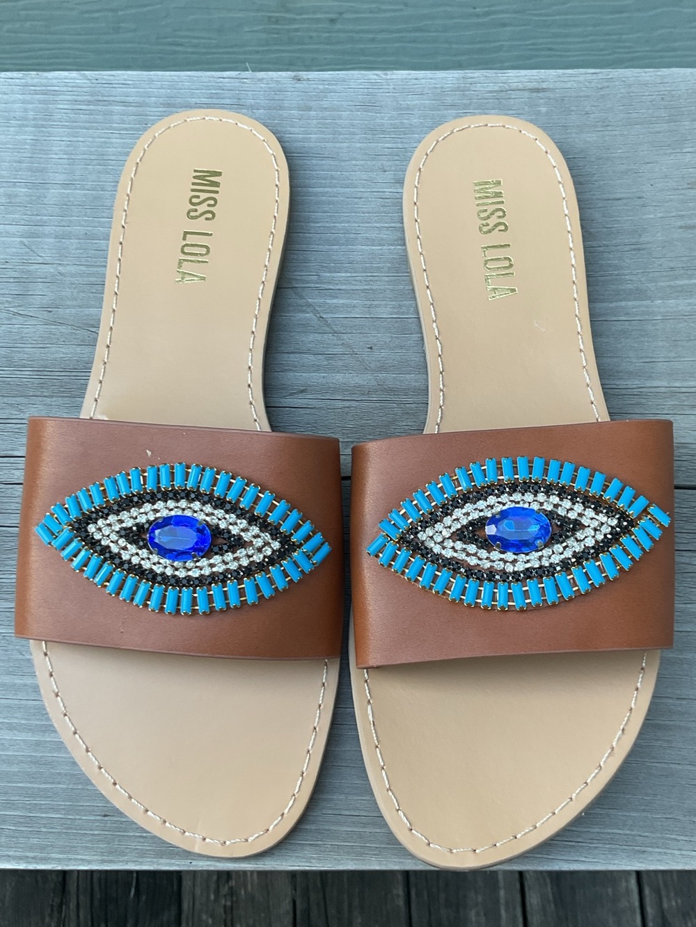 Miss Lola Tan Brown Slide Sandals with Gemstone Eye Detail